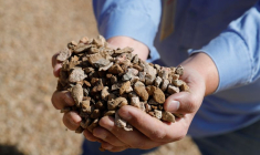 Matt Green, mining/crushing supervisor at MP Materials, displays crushed ore before it is sent to the mill at the MP Materials rare earth mine in Mountain Pass